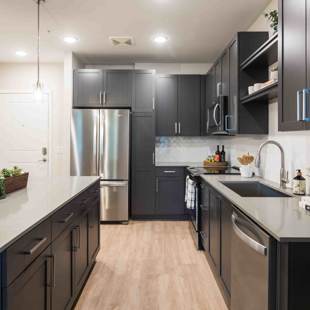 Live 8 West - Spacious kitchen with stainless steel appliances