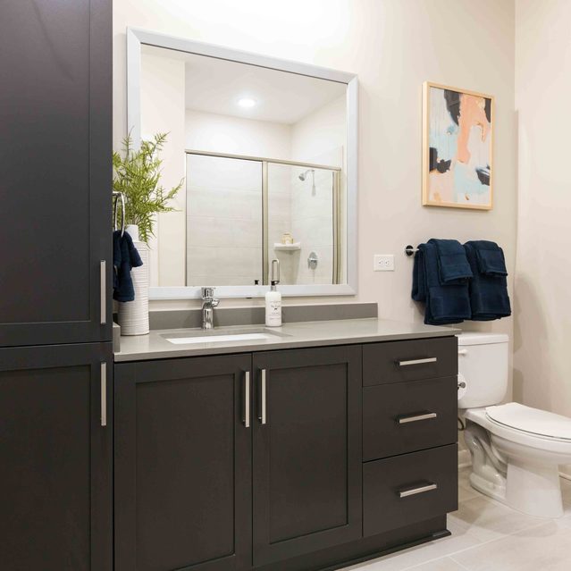 Live 8 West - Large bathroom with black cabinets
