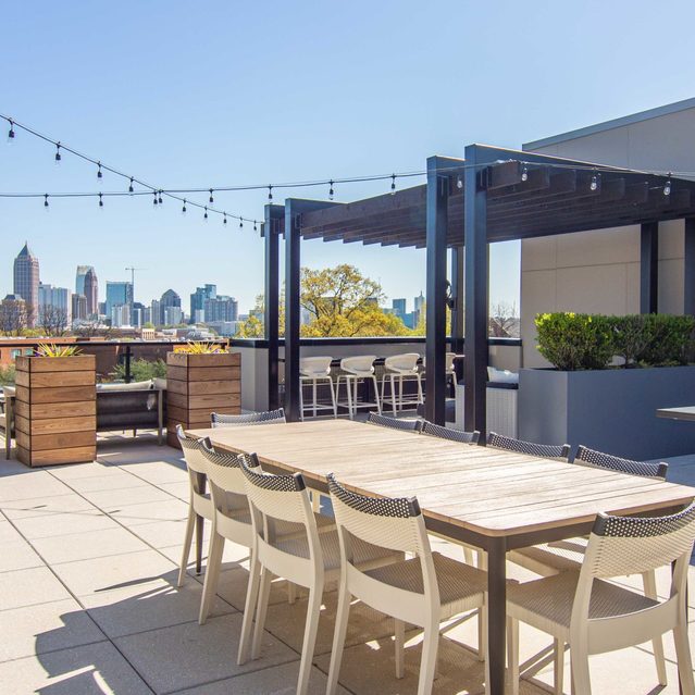 Live 8 West - Rooftop with dining table and board games